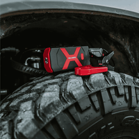 Portable Vehicle Jump Starter on Tire